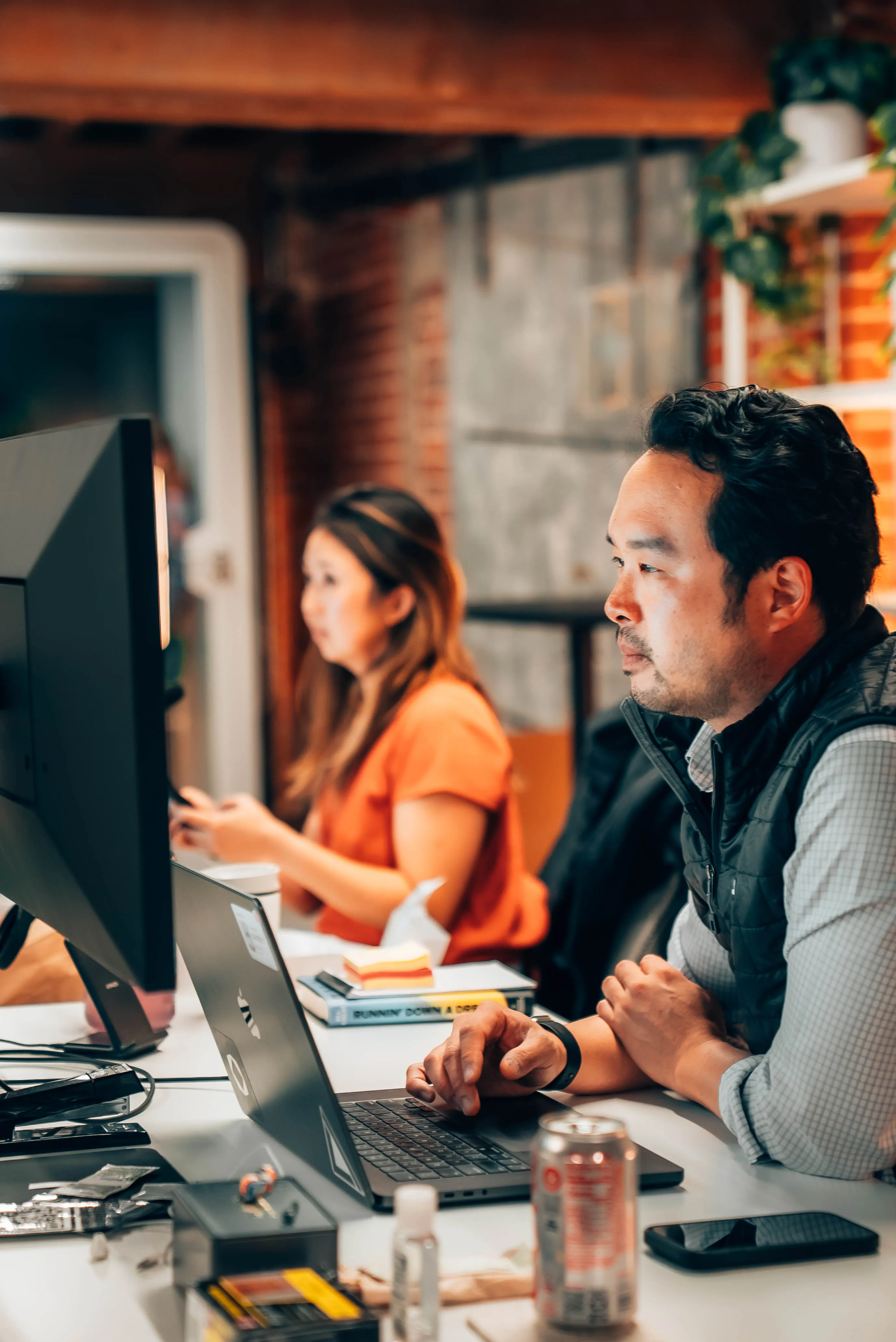 Founders working side by side at the Outcast office